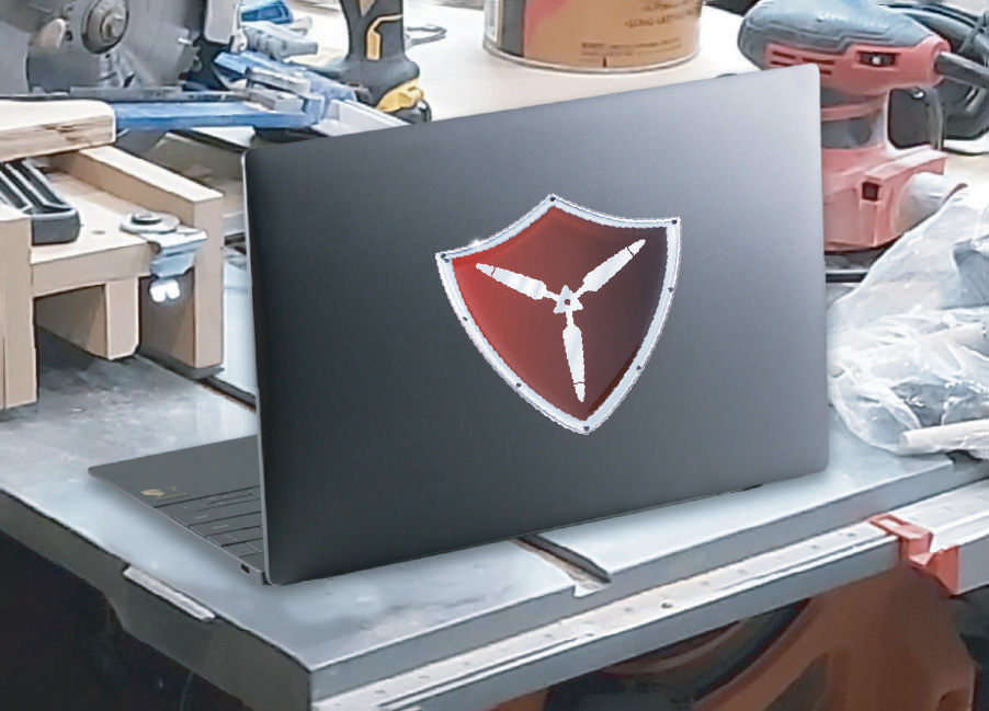 Domed label on a laptop in a workshop